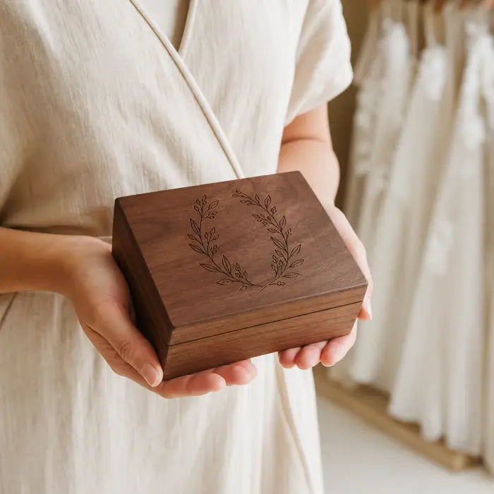 Personalized walnut keepsake box held naturally in two hands